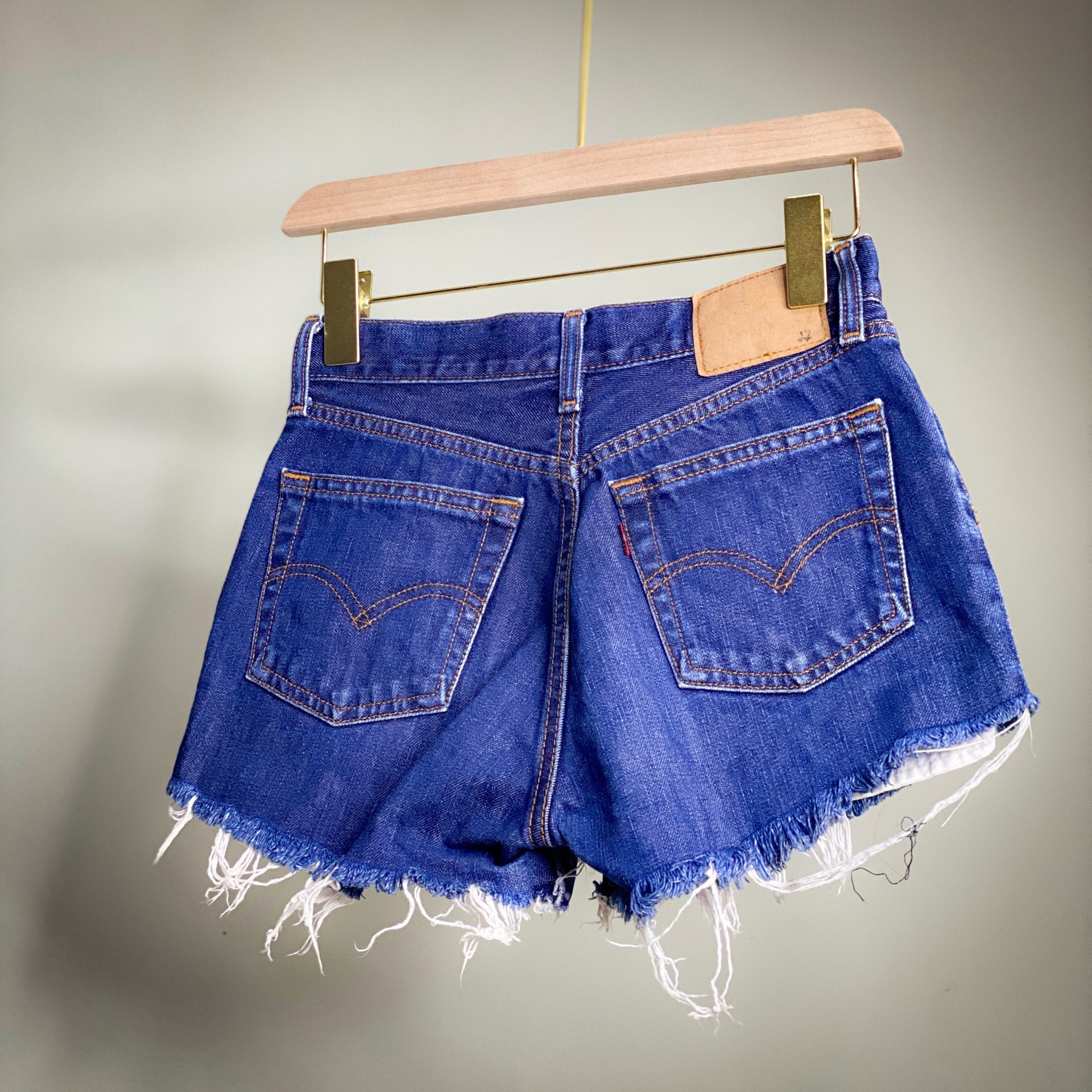LEVIS CUT OFF DENIM SHORTS // Zipper fly; waist fits 25-26