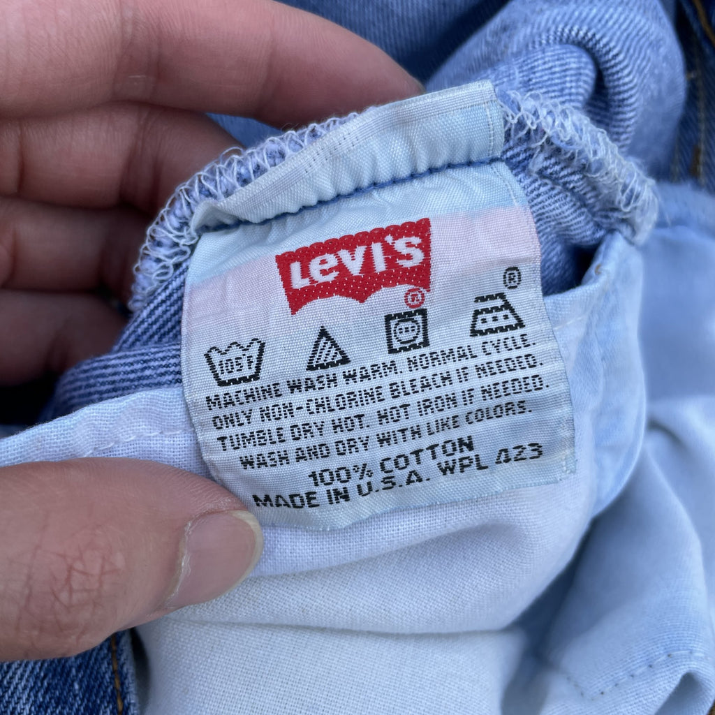 Vintage Levi 501 0115 made in usa 33x30 denim jeans medium blue faded 90s