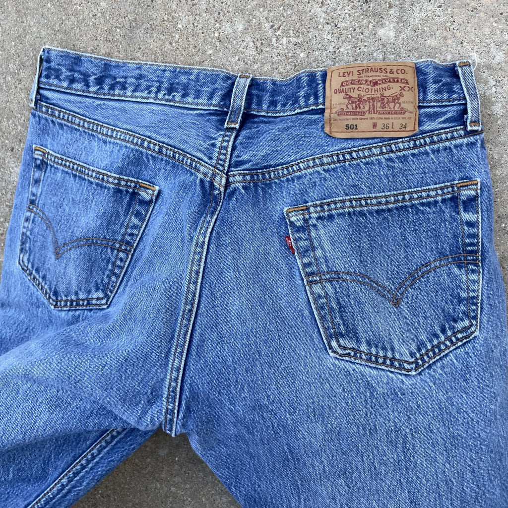 Vintage Levi 501 0115 made in usa 33x30 denim jeans medium blue faded 90s