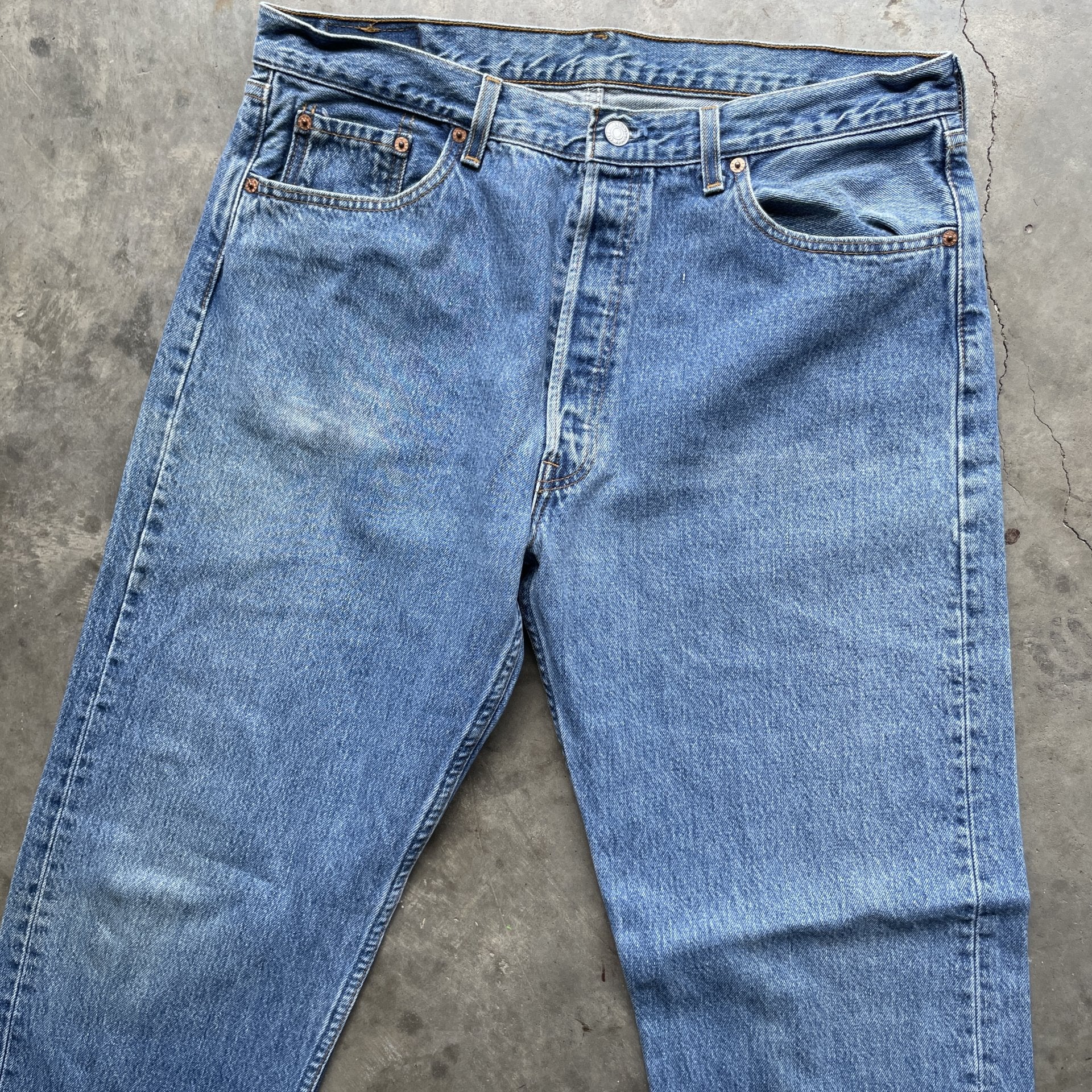 Vintage 90s Levi 501 medium wash blue denim jeans 38x34 fit 35x33