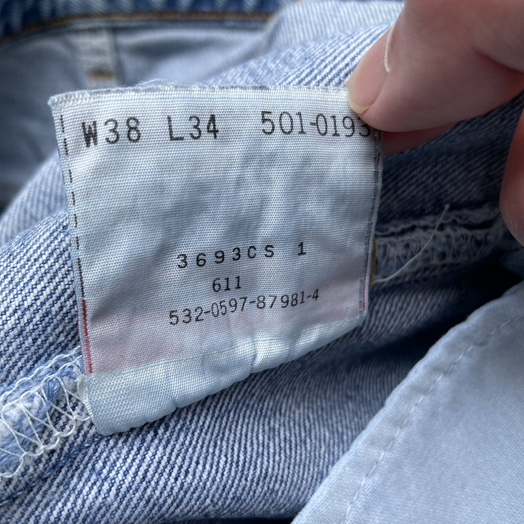 Vintage 90s Levi 501 medium wash blue denim jeans 38x34 fit 35x33