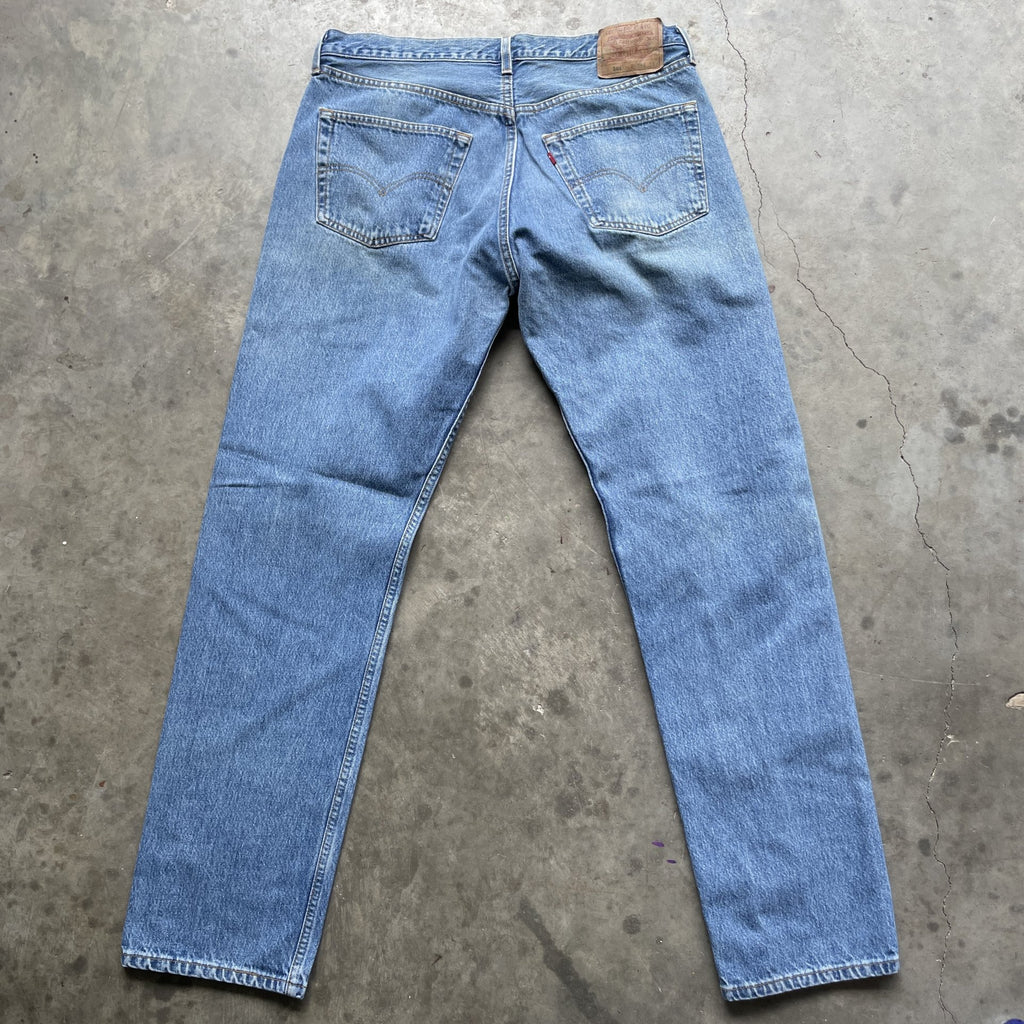 Vintage 90s Levi 501 medium wash blue denim jeans 38x34 fit 35x33